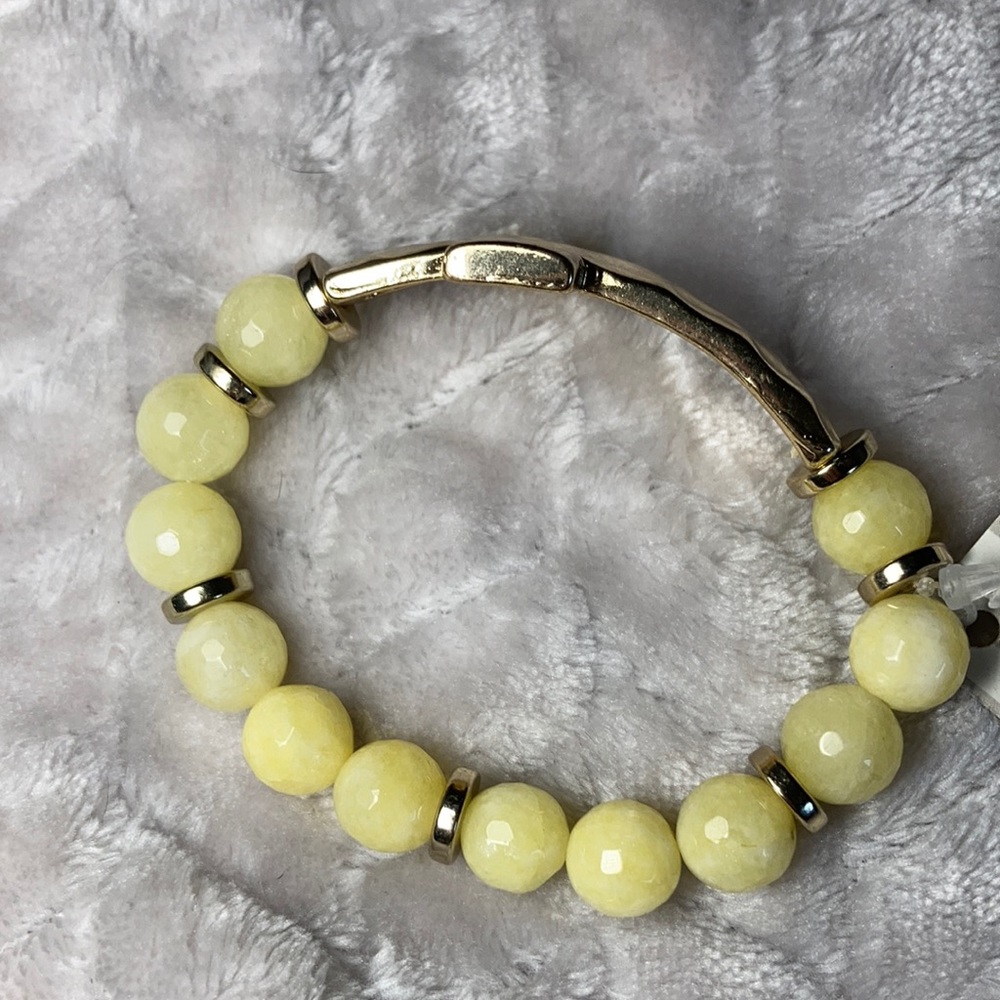 Yellow and gold bracelet with gold cross